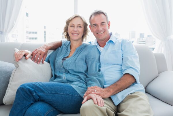 couple smiling on the couch