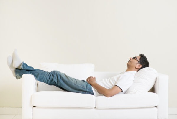 man resting on the couch