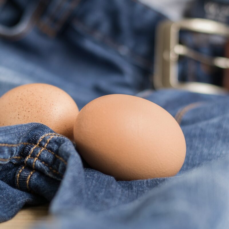 two eggs on a pair of jeans